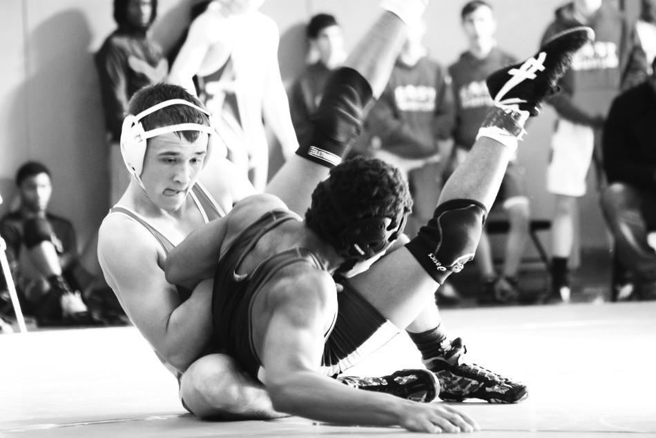Swenson (14) meaneuvers to pin his opponent en route to one of his many victories.