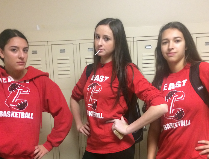 Cassidy Rosen-Swell (16), Ally Lazarus (16) and Emily Reisman (16) show off their school spirit by dressing up in East apparel.  