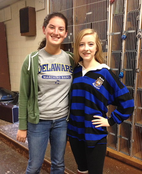 Olivia Marcelli (right) and Madeline Bowne (left) shows school spirit by wearing their college shirts. 