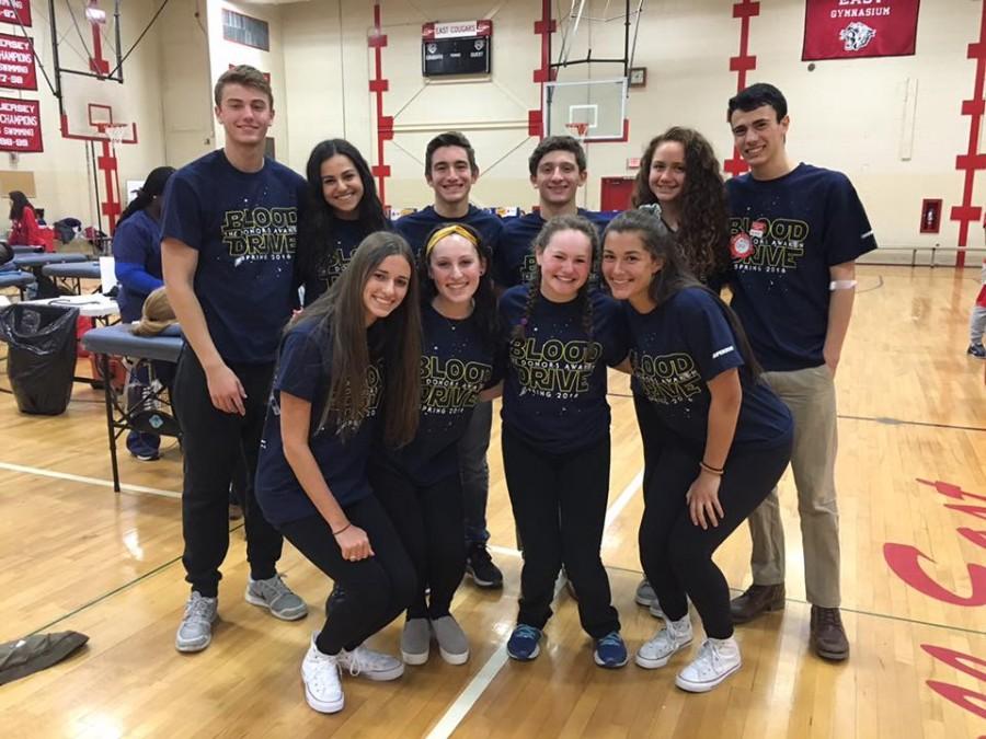 East blood drive members help prepare and manage the blood drive in school. 