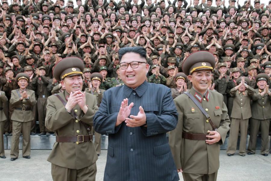 North Korean leader Kim Jong Un claps with military officers at the Command of the Strategic Force of the Korean Peoples Army (KPA) in an unknown location in North Korea 