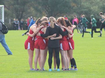 The Girls Cross Country team celebrates victory