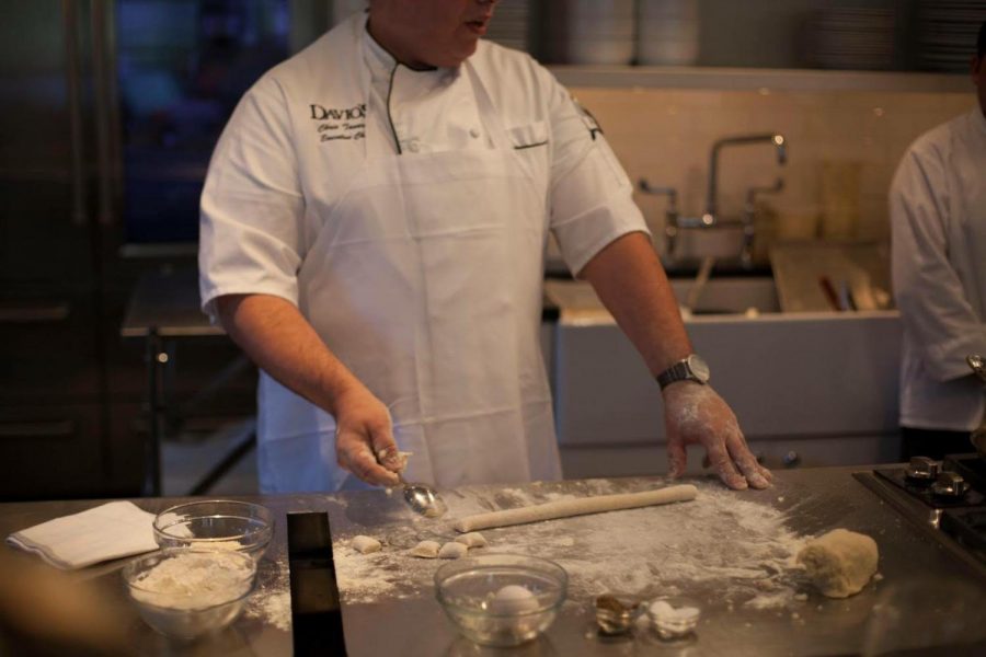 A chef at Davios prepares gnocchi as part of a traditional Italian dinner.  