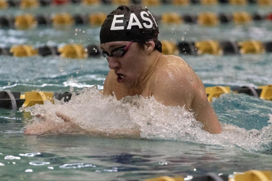 Justin Funari (19) swims the 100 breaststroke against Christian Brothers Academy.