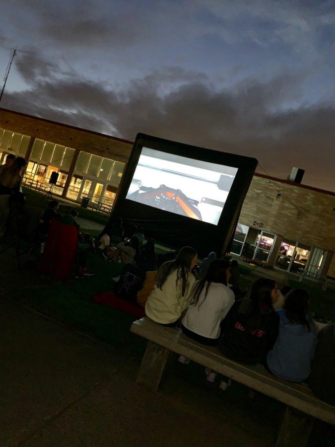East community members gather in the courtyard to watch Jaws.
