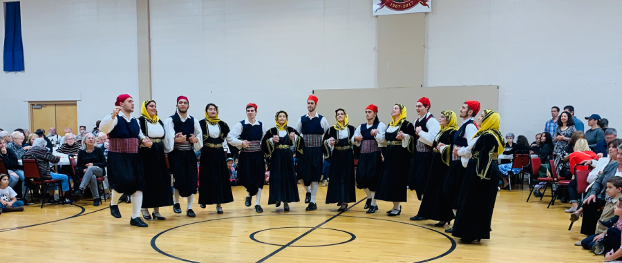 Dancers perform a traditional Greek dance live with Greek music at the Greek Agora Festival.