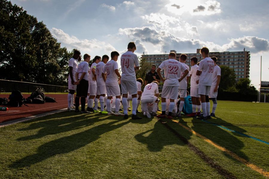 The Cougars share a moment together during halftime in their game against Bishop Eustace.