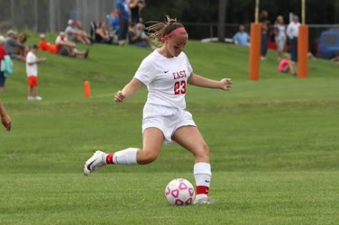 Caroline Perry (22) playing soccer for the Cherry Hill East girls soccer team.