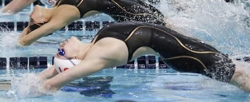 Emily Fekete ('23) swimming in a meet