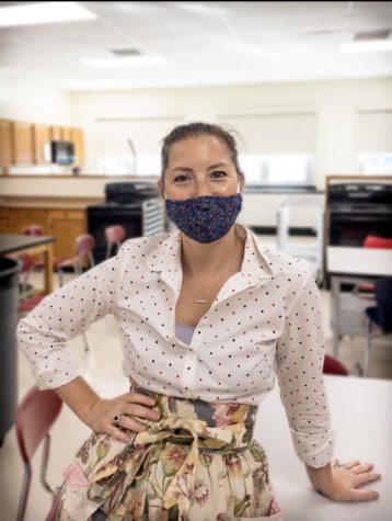 Fehder poses for a photo in FO-70 —where she teaches Culinary Arts I and II