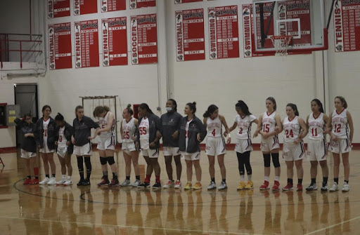 The Cherry Hill East girls basketball team lines up before the game starts