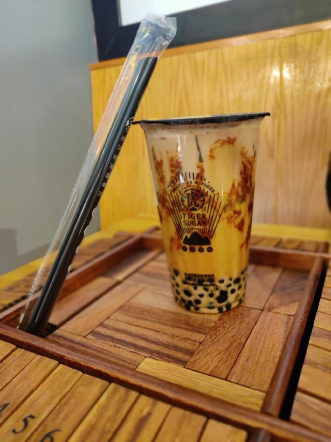 Tiger Sugars best selling drink is their Black Sugar Boba + Pearl Coffee Latte with Cream Mousse.