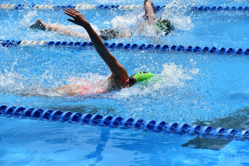 Sarah Teng (22) competing in a swim meet.