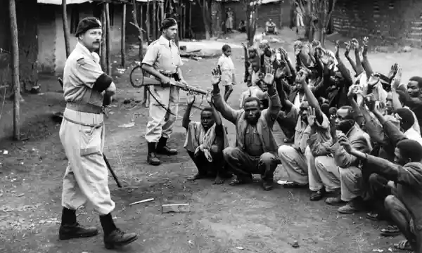 British soldiers and Mau Mau prisoners in the the Kenya Emergency during the 1950s. (Courtesy of The Guardian)