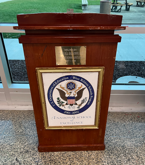 East uses seals that look like the Presidential Seal on podiums like this one.