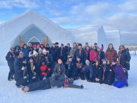Students and Chaperones stop for a picture in front of the Snow and Ice Hotel. 