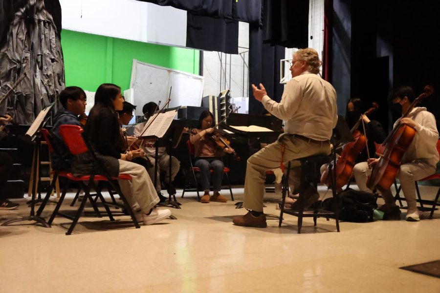 Keleher instructs the Symphony Orchestra