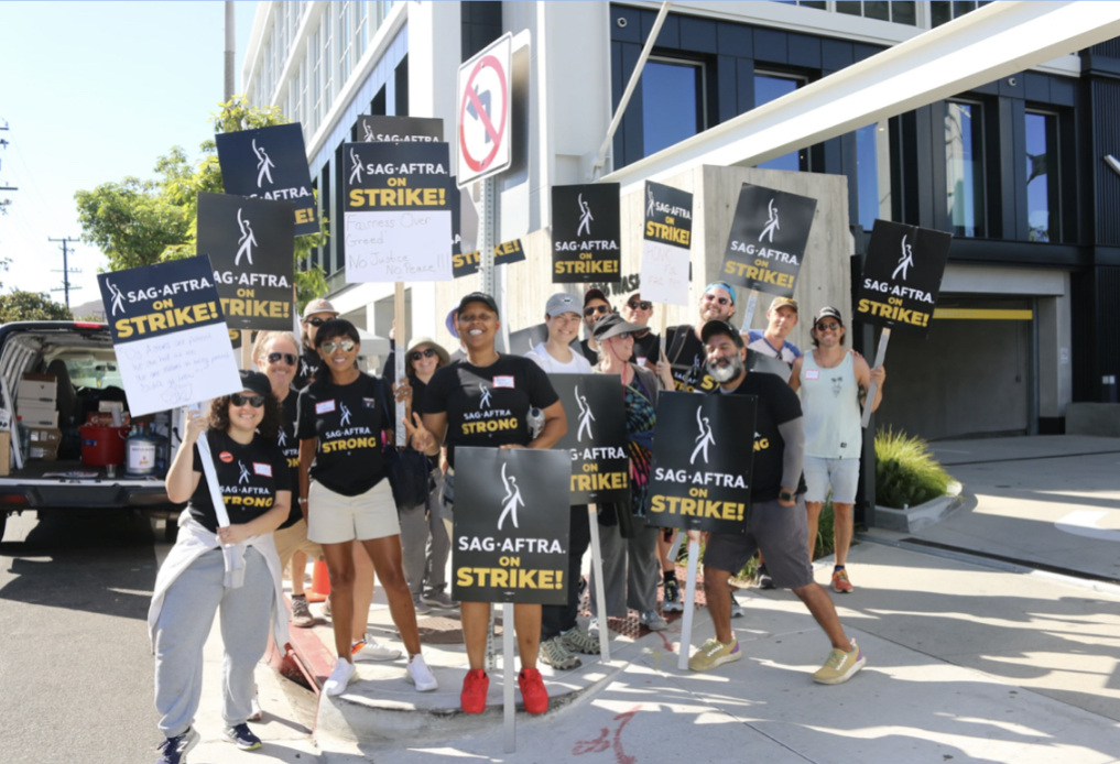 SAG-AFTRA+members+pose+for+picture+during+protest.%0A