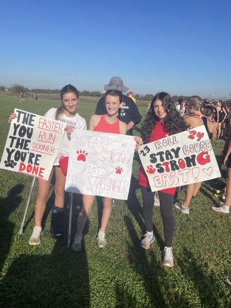 Cross Country girls cheering on their teammates.