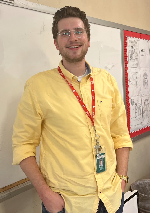 Mr.+Harrison+Weidner+poses+for+a+photograph+as+he+prepares+for+his+role+as+a+math+and+robotics+teacher.+
