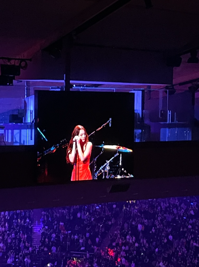 Headliner, Olivia Rodrigo, singing at the Jingle Ball in Madison Square Garden.