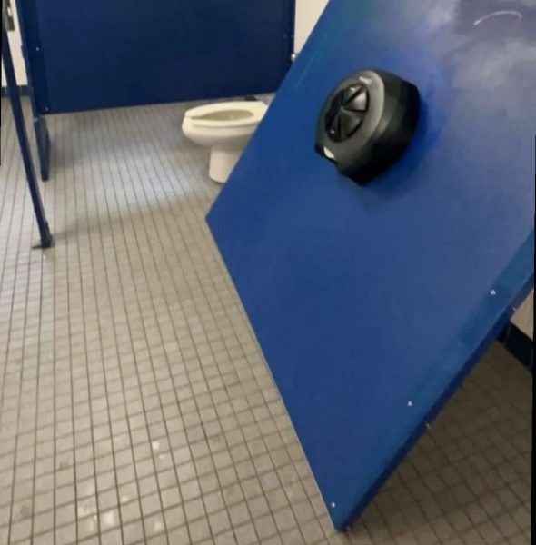 C-wing intersection boys bathroom is vandalized