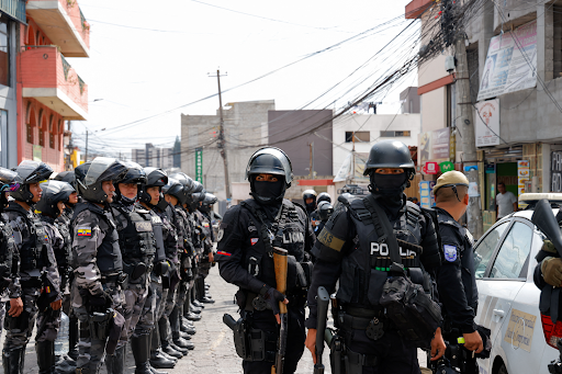 Ecuadorian police force gathers in response to the commotion (Courtesy of Reuters)