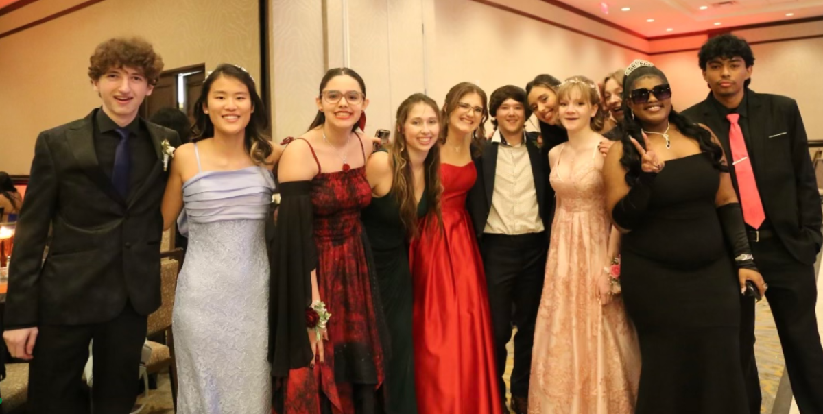 Students attending junior prom at The Westin Hotels & Resort pose for a photograph. 