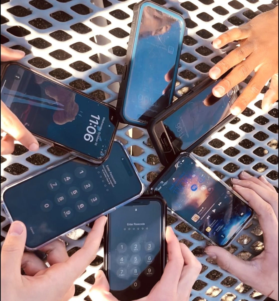 East students with their cell phones during lunch