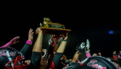 East football celebrates victory against West.