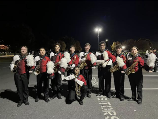 Several members of the Marching Band pose for a group photo after a performance.