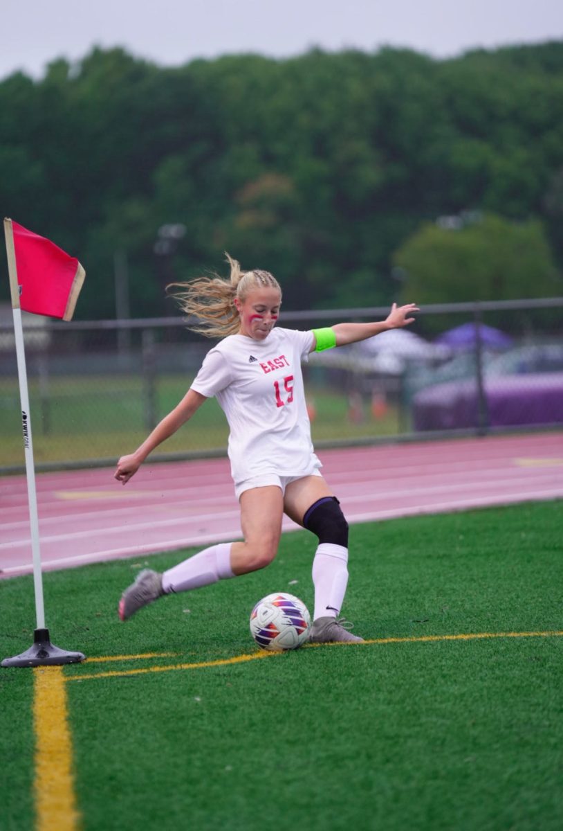 Maher takes a corner in the rivalry match against West.