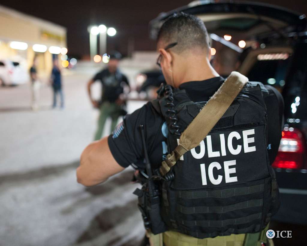 The Immigrations and Customs Enforcement agency cracks down on illegal immigrants.  "Immigrations and Customs Enforcement arrest" by Keith Gardner is in the Public Domain