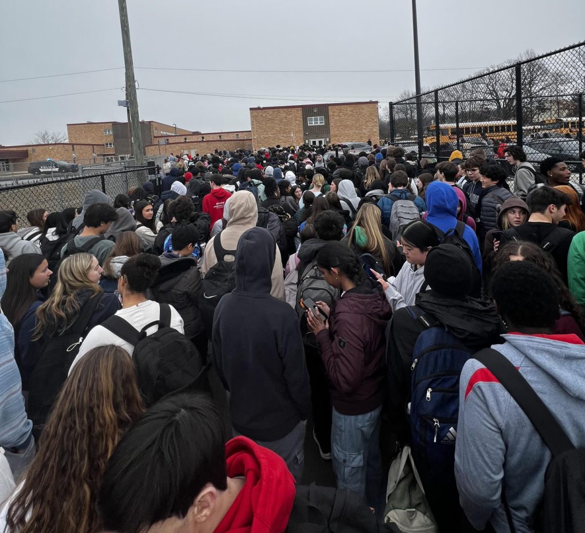 East students flock to the buses following orders to head to West