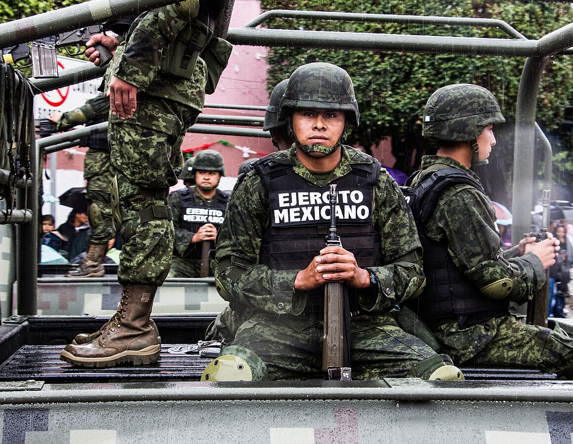 Mexico's armed forces battle heavily armed cartel members across the country.  "Mexican army soldier" by Tomás Castelazo is licensed under CC BY-SA 3.0