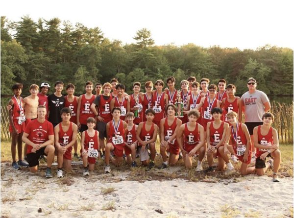 Coach Corey stands alongside his team of the 2024 season.