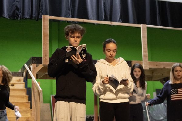 Justin Malec ('26) and Isabella Myers ('26) take notes in their scripts for their roles of Dracula and Lucy Westenra.