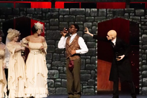 Justin Malec ('26) and Jamiir Rose ('26) rehearse a scene from Dracula, portraying Dracula and Jon Harker, respectively.