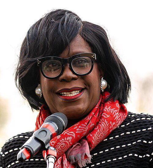 Philadelphia Mayor Cherelle Parker speaks at a ceremony adding Vanita Cruse to the street signs on the 7300 block of Stenton Avenue in recognition of her lifelong service to others and her advocacy in the optometry field. "Councilmember Cherelle Parker" by Philadelphia City Council is licensed under CC BY-SA 2.0