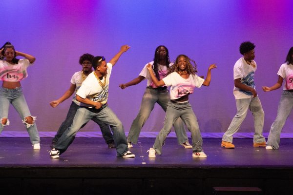 Kaelan Faria ('27) and Taylor Damon ('28) perform a partner dance during the African American Culture Club performance.