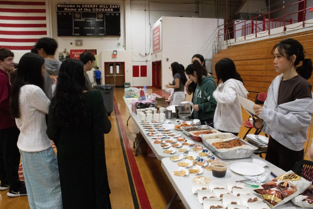 The Korean Culture Club offers various foods at their booth, such as Turtle Chips.
