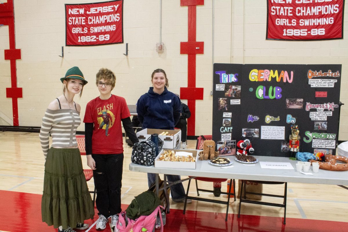 Members of the German Club pose for a photo beside their booth.