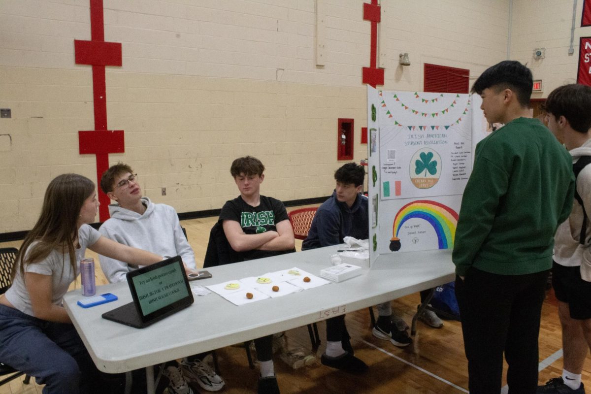 The Irish American Student Association booth gives Irish potatoes or sugar cookies if students perform an Irish jig.