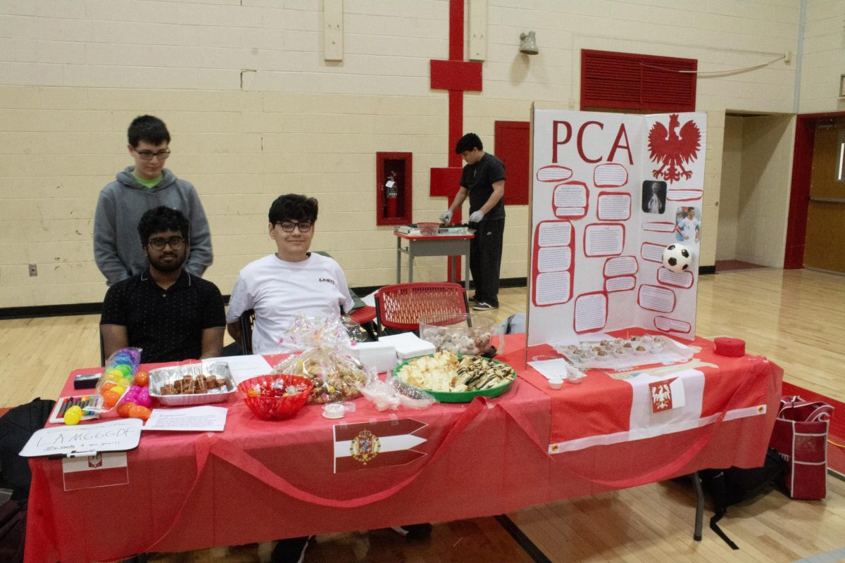 The Polish Cultural Association's booth features an informational tri fold and a variety of foods.