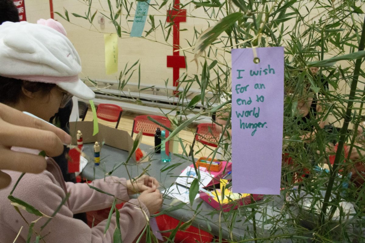 The Japanese Student Association offers papers for students to write their wishes on and tie to bamboo stalks.