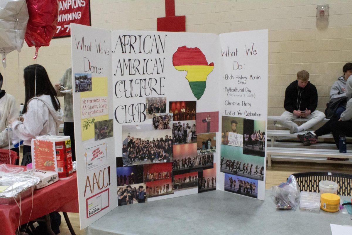 The African American Culture Club's booth features an informational tri fold of the club's achievements.