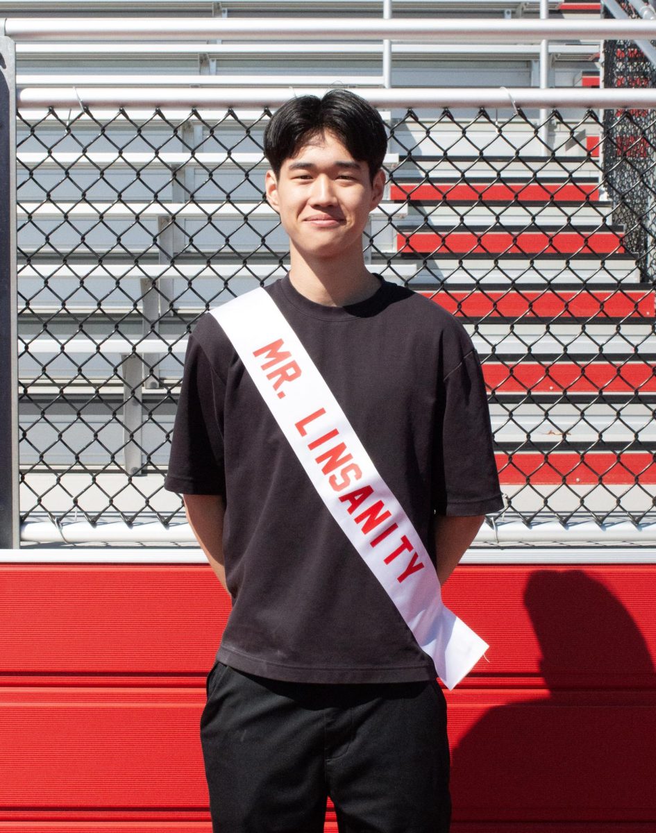 Alvin Lin ('26) poses for a photo with his Mr. East sash, assuming the identity of Mr. Linsanity.