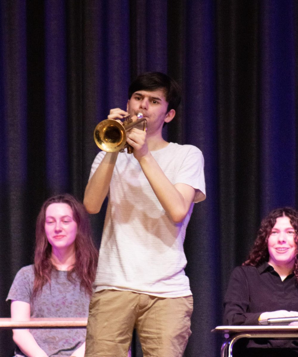 Mr. Know-It-All plays "The Final Countdown" on the trumpet during his act.