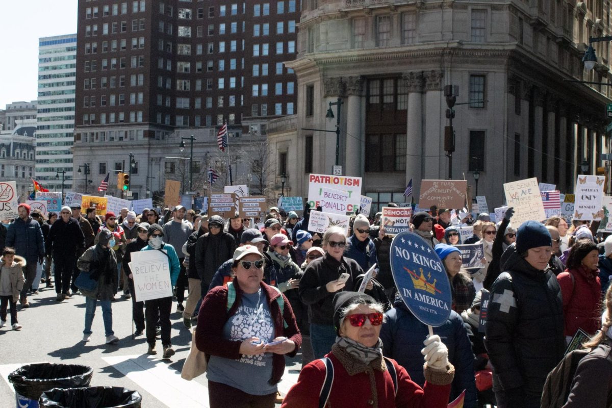 Protesters walk down the Benjamin Franklin Parkway during the Philadelphia No Kings protest on March 28. 