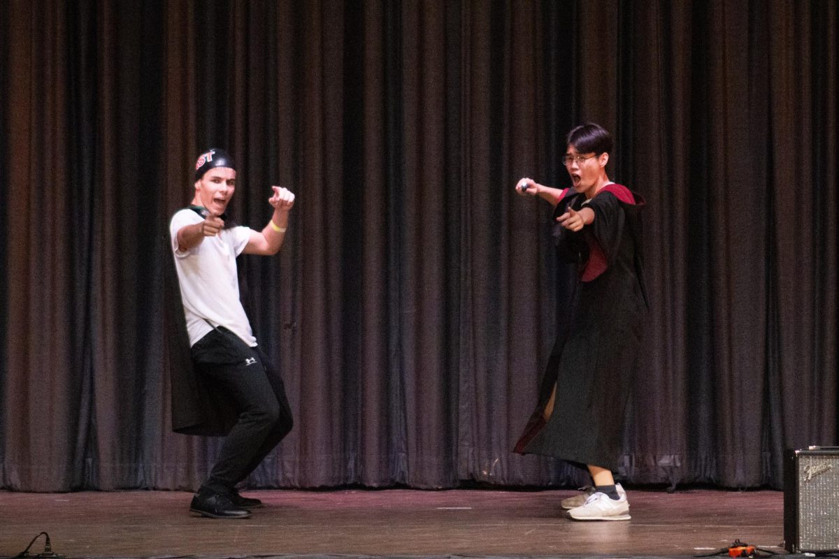 Mr. Linsanity, dressed as Harry Potter, performs a duo dance with one of the members of his act.
